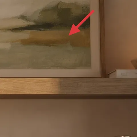 framed wall art above the shelf