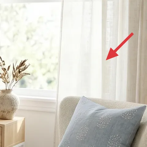 vase with dried stems on the window-side table