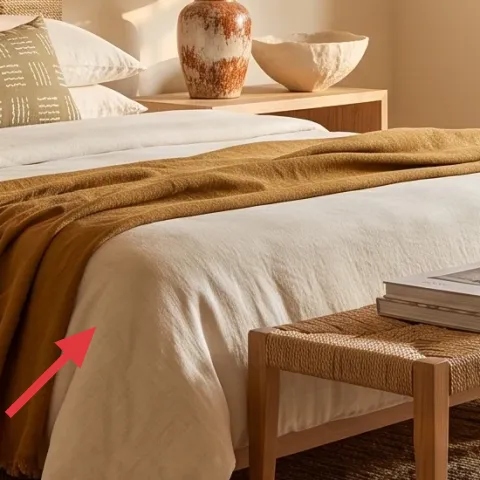 Throw blanket draped across bed