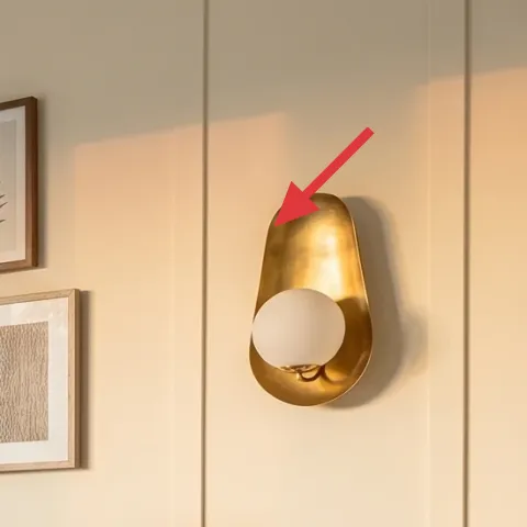 gold wall sconce with white glass shade